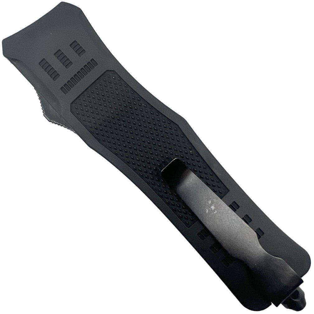 a side view of a folded black 3.25" Automatic OTF Steel Knife with Glass Breaker showing its metal clip