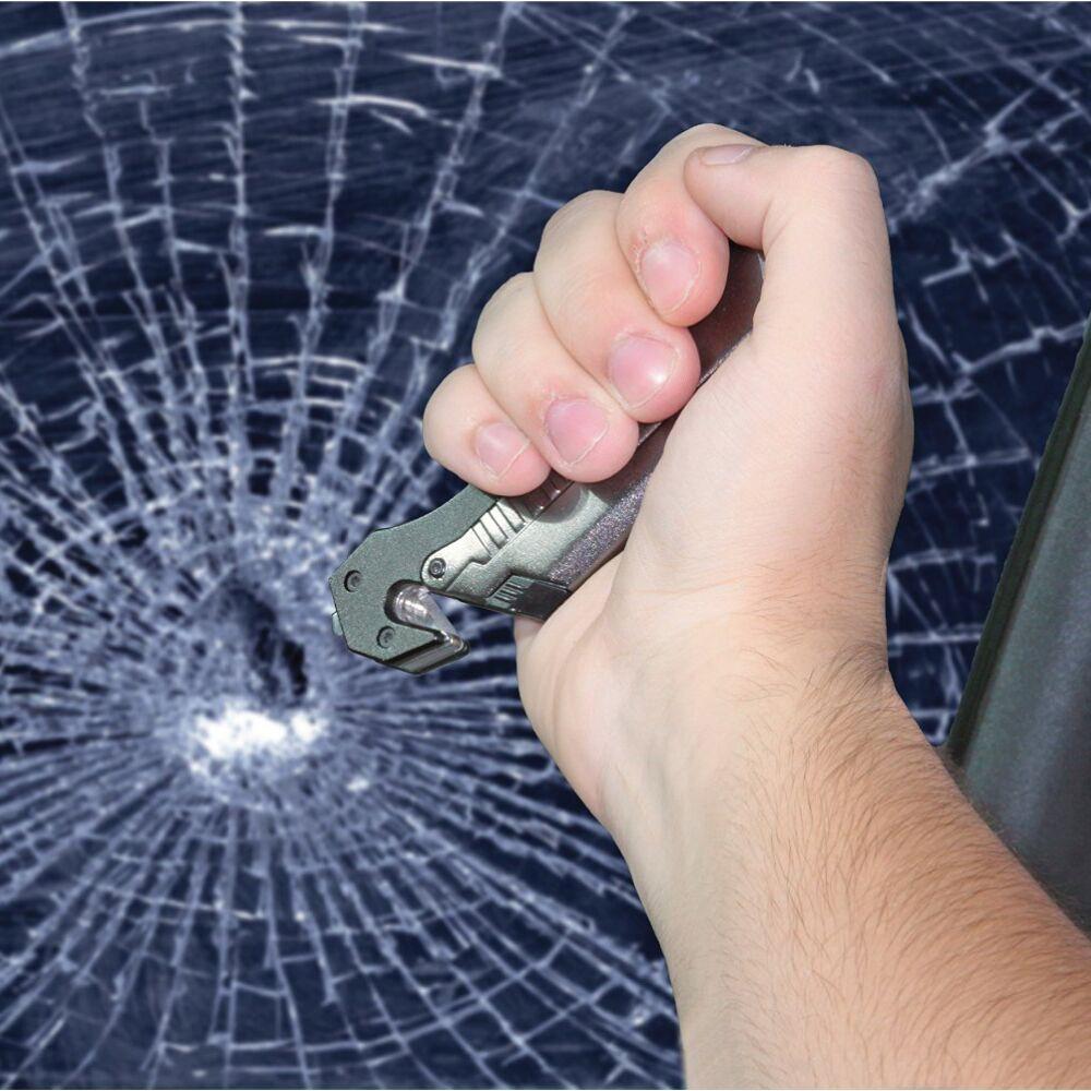 a hand smashing a window with a Tiger-USA 5-in-1 EDC Folding Survival Pocket Knife