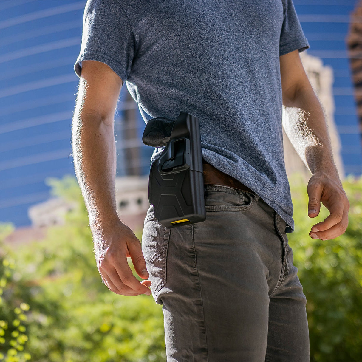 TASER X2 self-defense device securely holstered on a person’s belt for easy access