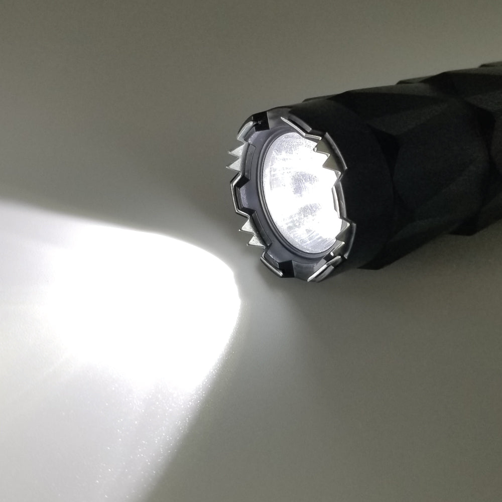 Close-up of Safety Tech Bouncer stun gun's flashlight head turned on