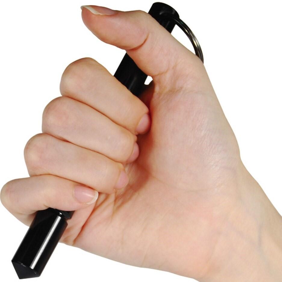 Hand holding a 5.5" Black Tactical Pointed Tip Aircraft Aluminum Kubotan from WeaponTek