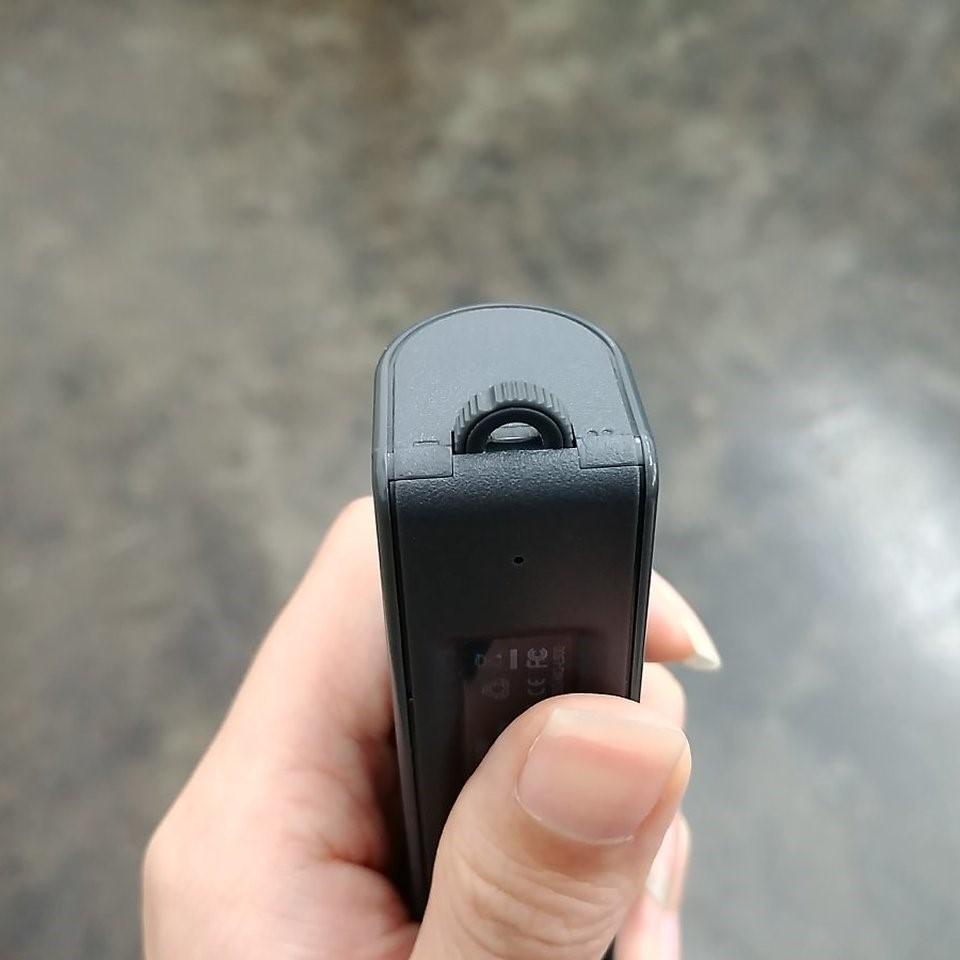 Close-up of the end of the Voice Recorder & Power Bank showing the control wheel held by a hand