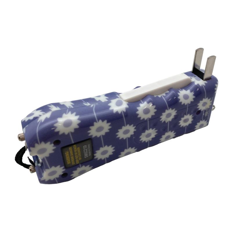 Streetwise™ Ladies' Choice LED Stun Gun Alarm in a lavender and white daisy floral pattern with built-in charging prongs and wrist lanyard