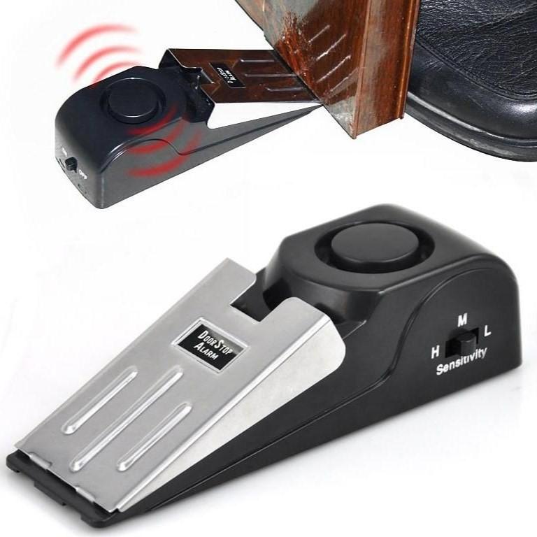 a view of a Streetwise Super Door Stop Wedge Portable Alarm showcasing its built in sensors.