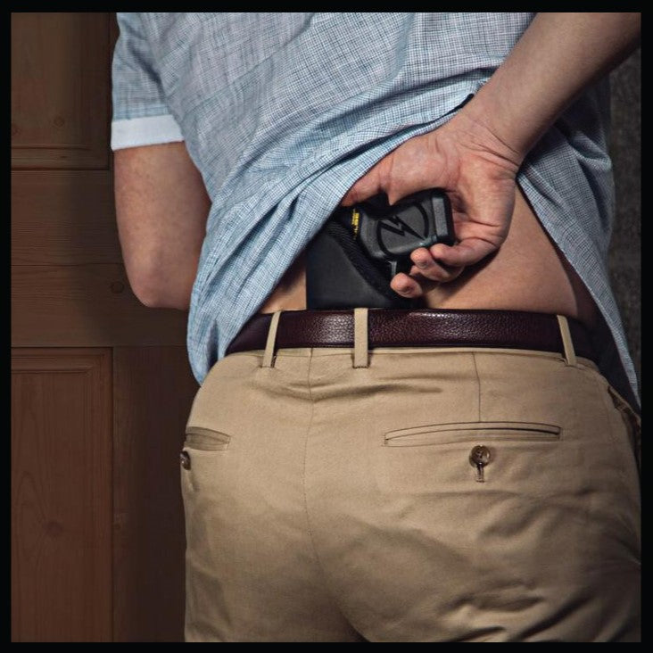 a photo example of a man with a TASER Pulse IWB Ambidextrous Sticky Holster attached to his belt