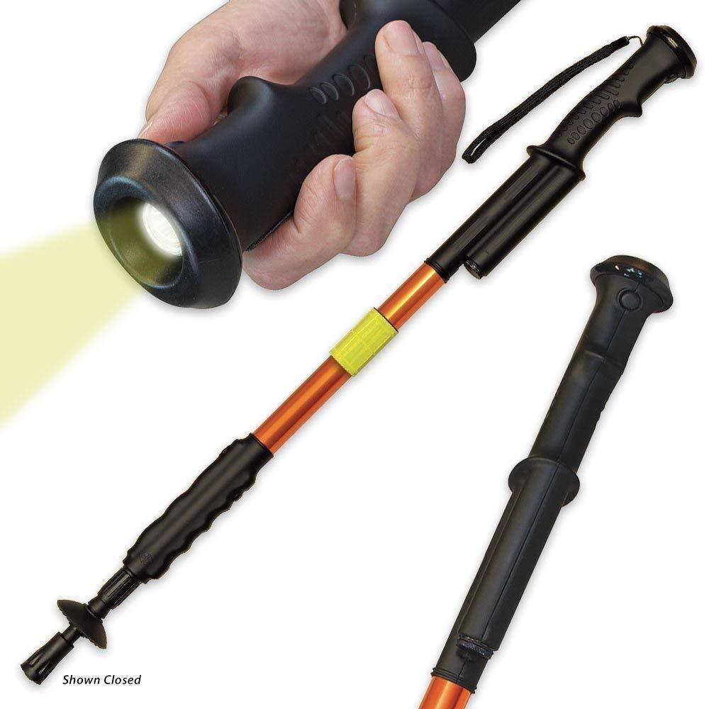 a hand holding a ZAP Hike 'n Strike™ LED Stun Gun Staff to use its light