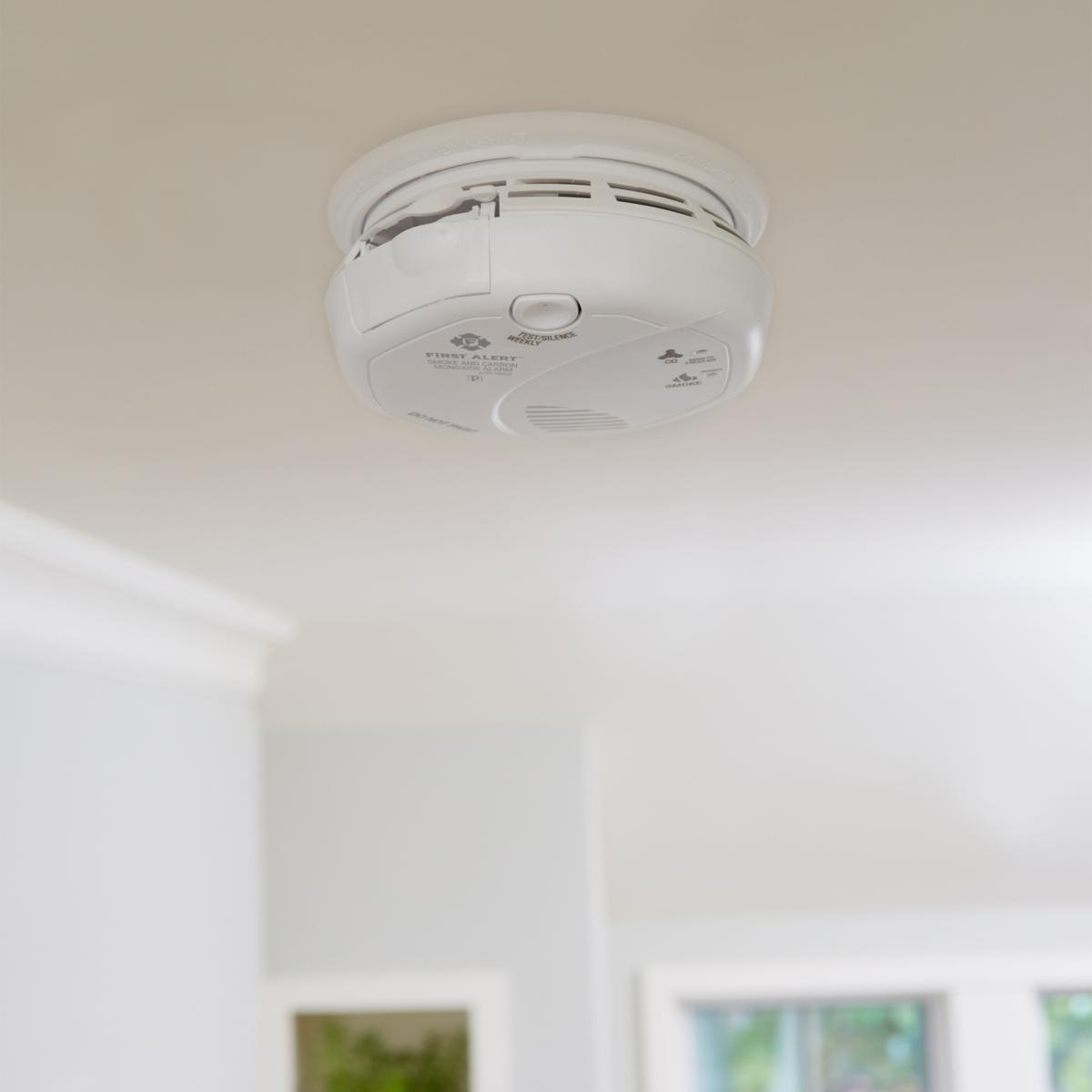 White Smoke Detector Hidden Dual Lens Night Vision Spy Camera 4K UHD WiFi from Spywifimounted on a white ceiling