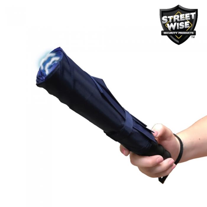 Hand holding a Blue Stunbrella Stun Gun Flashlight from Streetwise with wrist strap in hand