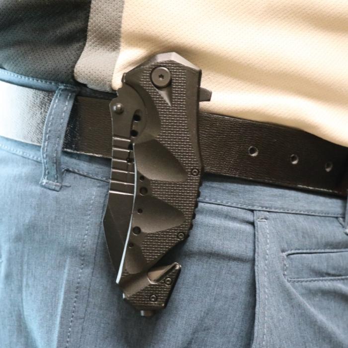 a Black 3.75" Stainless Steel EDC Tactical Folding Pocket Knife by ElitEdge clipped to a person's belt