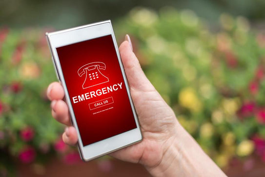 hand holding smartphone emergency app