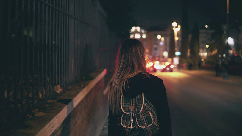 Girl goes through the city late at night alone