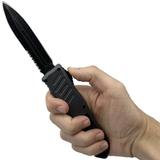 A hand holding an open black 3.25" Armed Force Tactical OTF Dagger Knife
