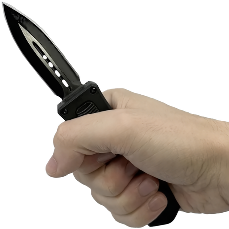 A hand holding an open black 3" Armed Force Tactical Mini Automatic OTF Dagger Pocket Knife
