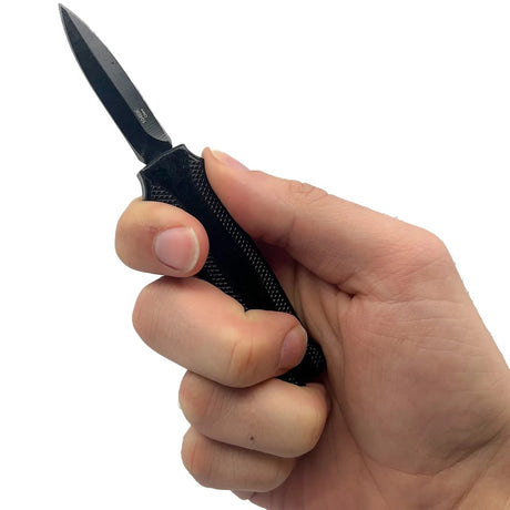 A hand holding a black 1.9" ElitEdge Mini Automatic OTF Keyring Pocket Knife