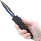 A hand holding an open black and blue 3.25" Armed Force Tactical OTF Dagger Knife
