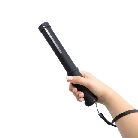 Hand holding a black 10" Streetwise Mini Lightning Rod Stun Gun Baton 7M