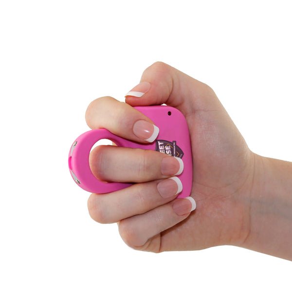 Pink Sting Ring Rechargeable Stun Gun gripped by hand