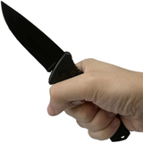 A hand holding a black 3.5" automatic  OTS Pocket Drop Point Knife Spring assisted