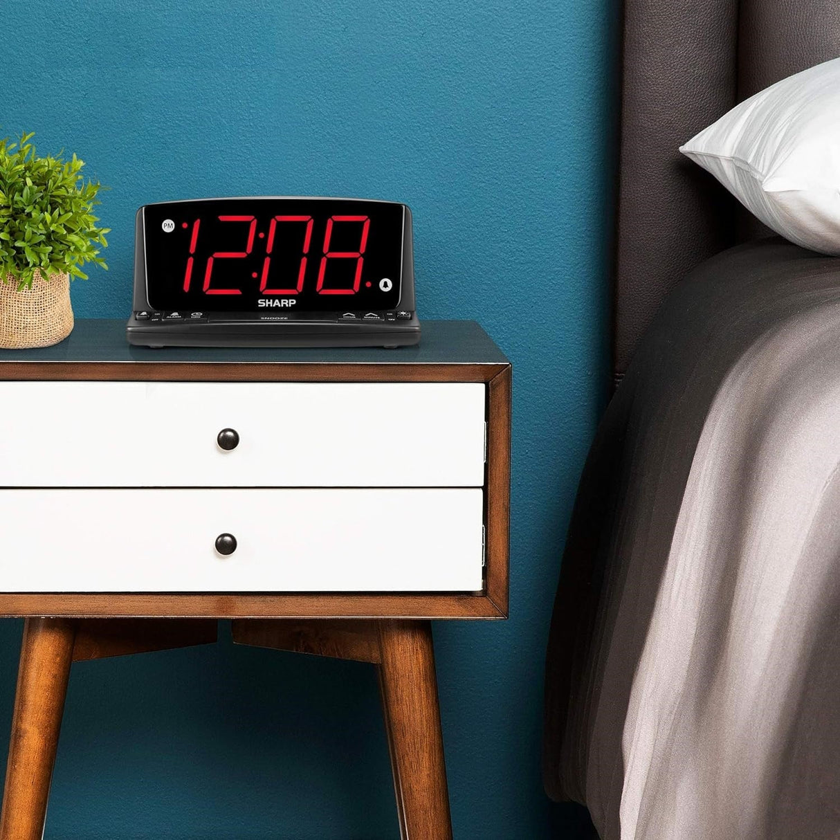 SpyWfi Alarm Clock Radio Hidden Motion Detection Spy Camera 4K UHD WiFi displayed on bedside table