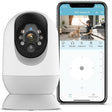 A white SpyWfi Nanny Security Wifi Camera 2K with night vision and auto tracking next to a smartphone with displayed monitoring app