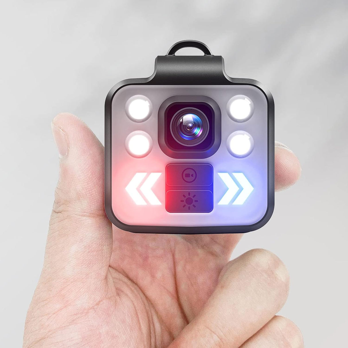 a hand holding a SpyWfi Mini Rechargeable LED Waterproof Body Camera