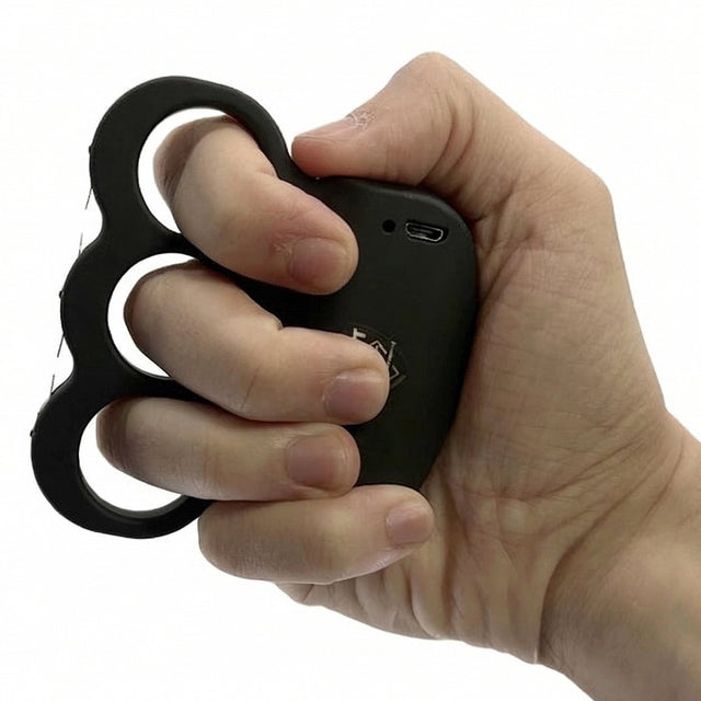 Triple Sting Ring Rechargeable Stun Gun from Streetwise gripped in hand