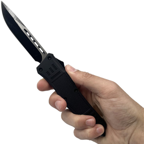 A hand holding a 3.75" Automatic OTF Steel Knife with Glass Breaker from Streetwise