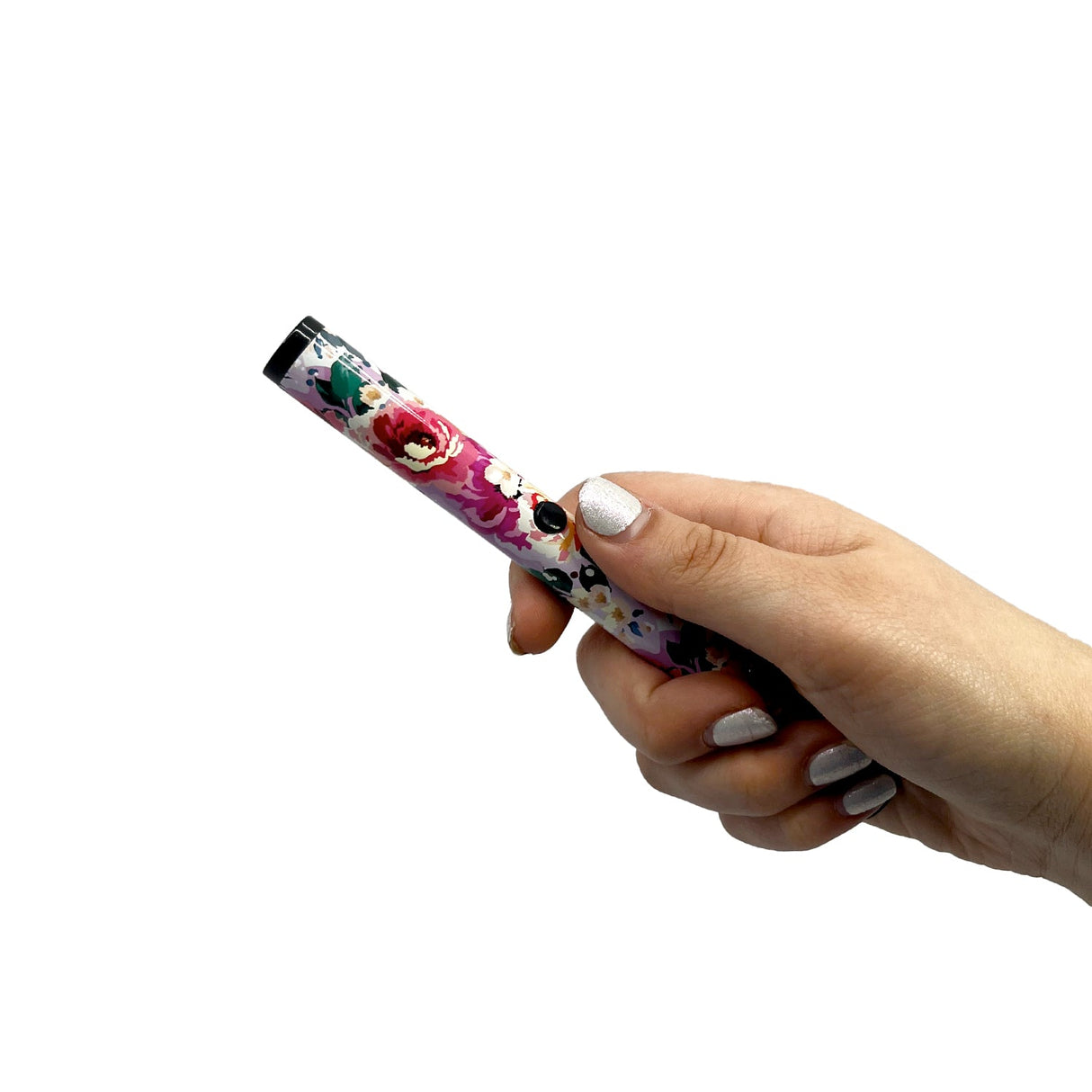 A hand holding a streetwise pain pen in floral design