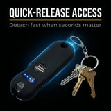 Black keychain device with keys on a dark background, emphasizing quick-release access feature.