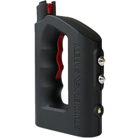 A black Stunner brand pepper spray jogger with integrated stun gun features, including a red activation button and silver metal points.