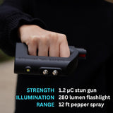 a hand holding a The Stunner 3-in-1 Rechargeable LED Stun Gun Pepper Spray Jogger Combo, with descriptions of the appearance 