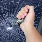 a hand smashing a window with a Tiger-USA 5-in-1 EDC Folding Survival Pocket Knife 