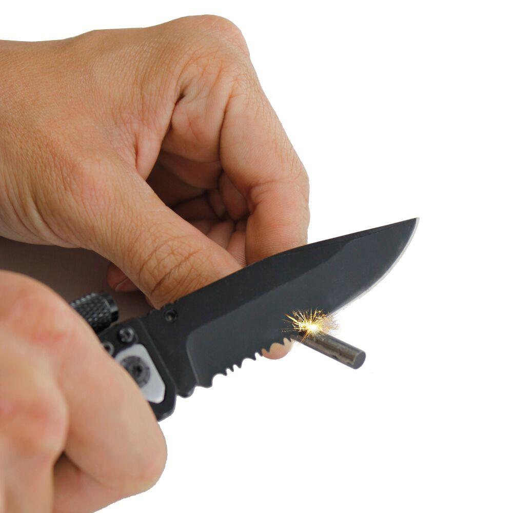 a hand using Tiger-USA 5-in-1 EDC Folding Survival Pocket Knife with a Fire Starter