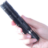 a hand holding a Tiger-USA Xtreme SHOCKDROP Stun Gun Flashlight 100M