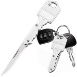 A silver WeaponTek Fake House Key Concealed EDC Folding Pocket Knife designed to look like a house key, displayed alongside actual keys and a key fob.