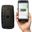 Black iTrail Endurance Rechargeable Long Life 4G GPS Tracker and a hand holding a smartphone with the iTrail app running