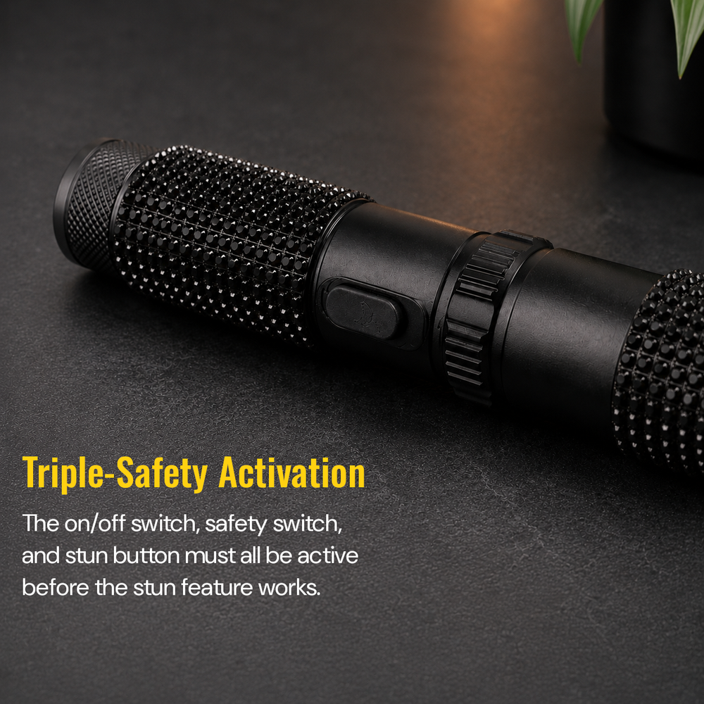 Close-up of JOLT RhineStun rechargeable flashlight showing the on/off switch and rhinestone grip