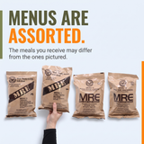 Four military-style meal pouches are shown on a light gray background with large promotional text reading 'MENUS ARE ASSORTED.' A human hand holds one of the pouches, so this is classified as Lifestyle rather than Product/Packaging.