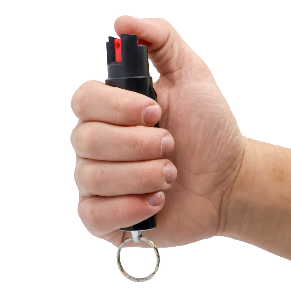 hand holding streetwise 18 pepper spray keychain in hand with thumb on twist lock safety
