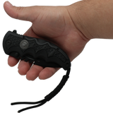 Hand holding a closed Black 3.5" folding stainless steel pocket knife with paracord by Elite Edge