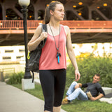 A woman wearing a blue ASP Metro Defender D2 Keychain Pepper Spray Baton for self defense