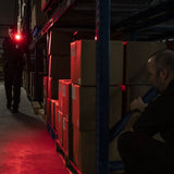 A cop using the red light of ASP Spectrum DF Police Duty Rechargeable LED Flashlight 300 lm at work