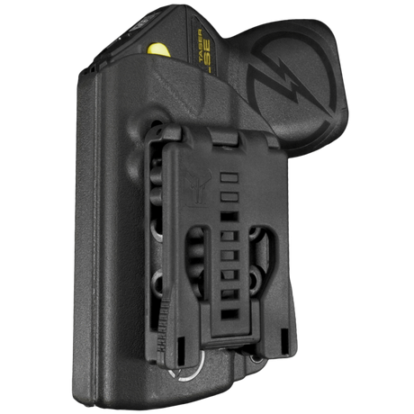 Black Blade-Tech Kydex holster with an adjustable clip, holding a TASER Pulse stun gun