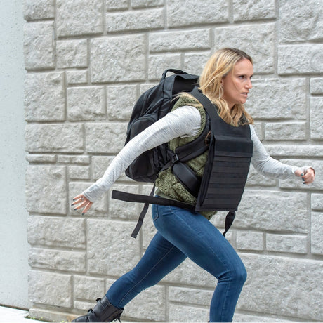 woman wearing a Bodyguard Switchblade Level IIIA Bulletproof Backpack & Vest while running