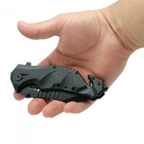 a hand carrying a closed Black 3.75" Stainless Steel EDC Tactical Folding Pocket Knife by ElitEdge