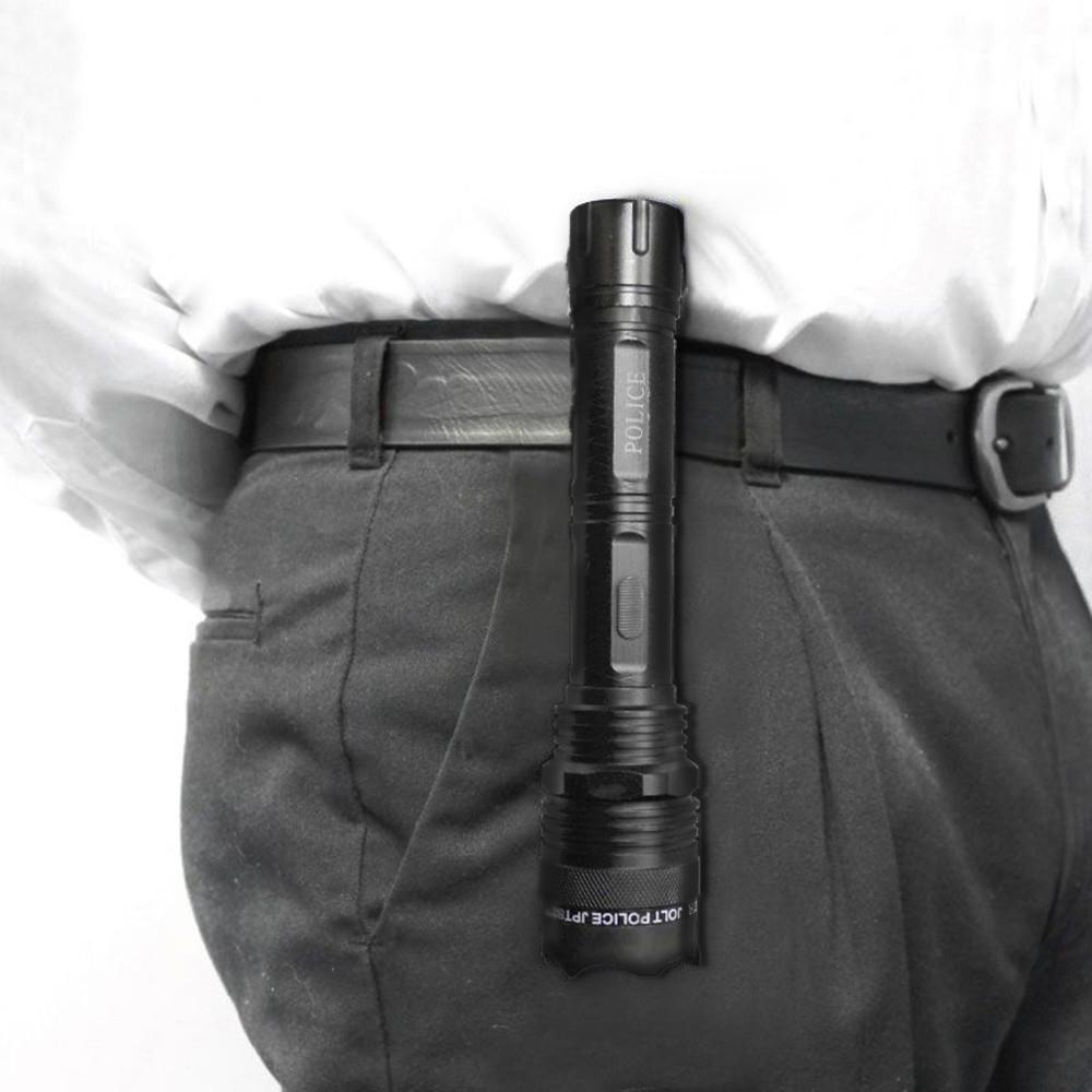 A 95M JOLT Rechargeable Police Stun Gun Flashlight clipped in a person's belt
