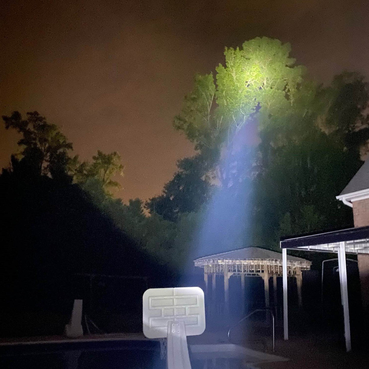 Police Force Tactical Torch Stun Gun Flashlight turned on in the dark