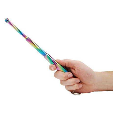 Hand holding a multi-colored 12" Safety Tech Expandable Steel Keychain Baton fully extended