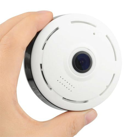 A hand holding a white SpyWfi Security Camera with motion activated and night vision feature in 1080p resolution with WiFi