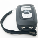 Black Fake Key Fob Mini Stun Gun Panic Alarm with grey buttons and wrist strap and visible stun probes